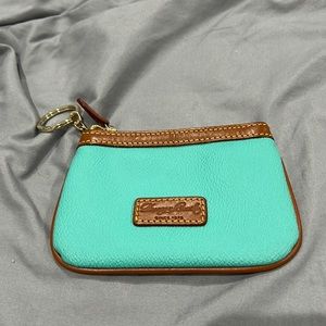 Dooney and Bourke teal change purse. Never used.